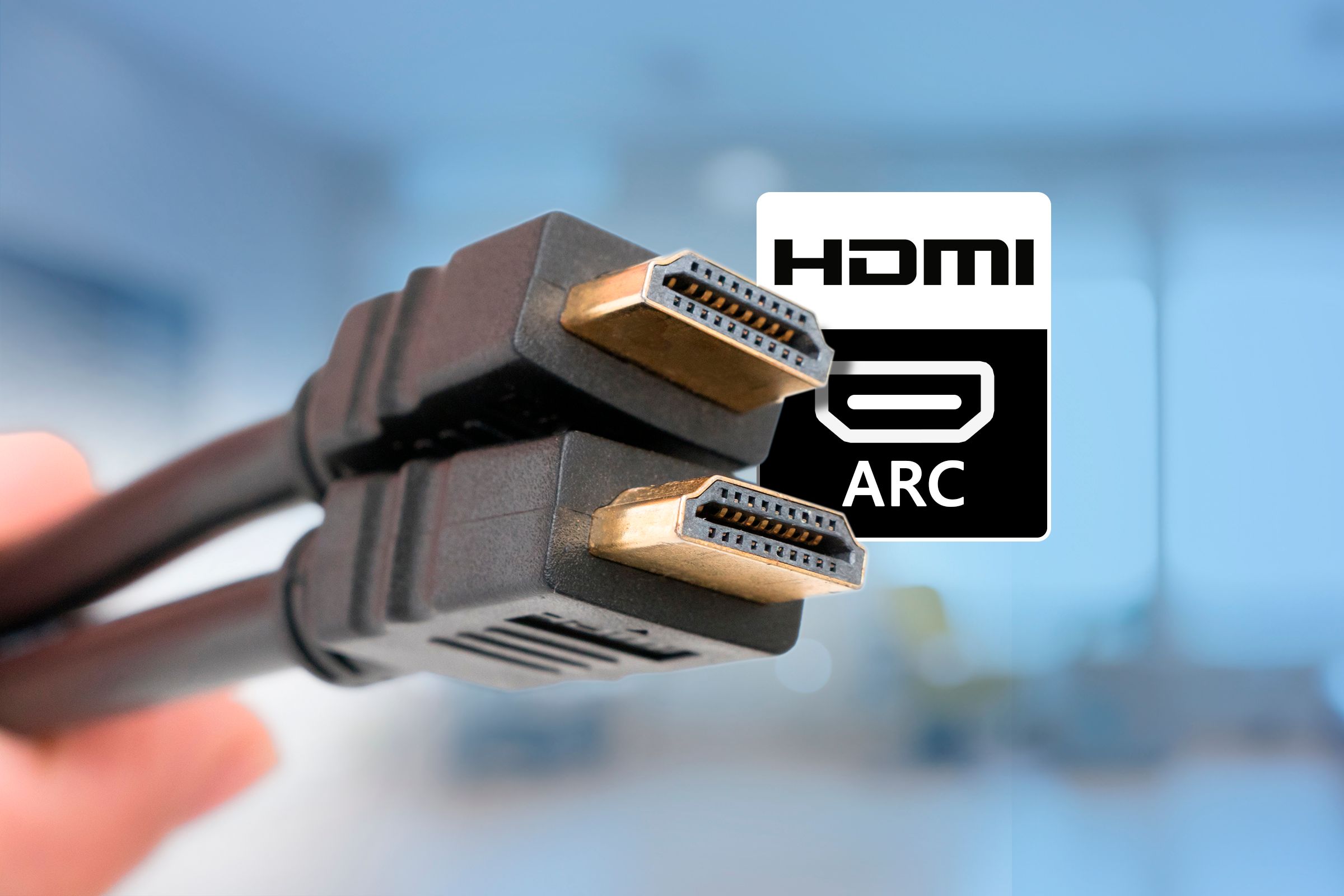 Dois cabos HDMI com o texto 'HDMI ARC' próximo a eles.