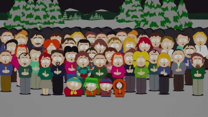 As pessoas de South Park cantando enquanto seguram velas "Parque Sul."