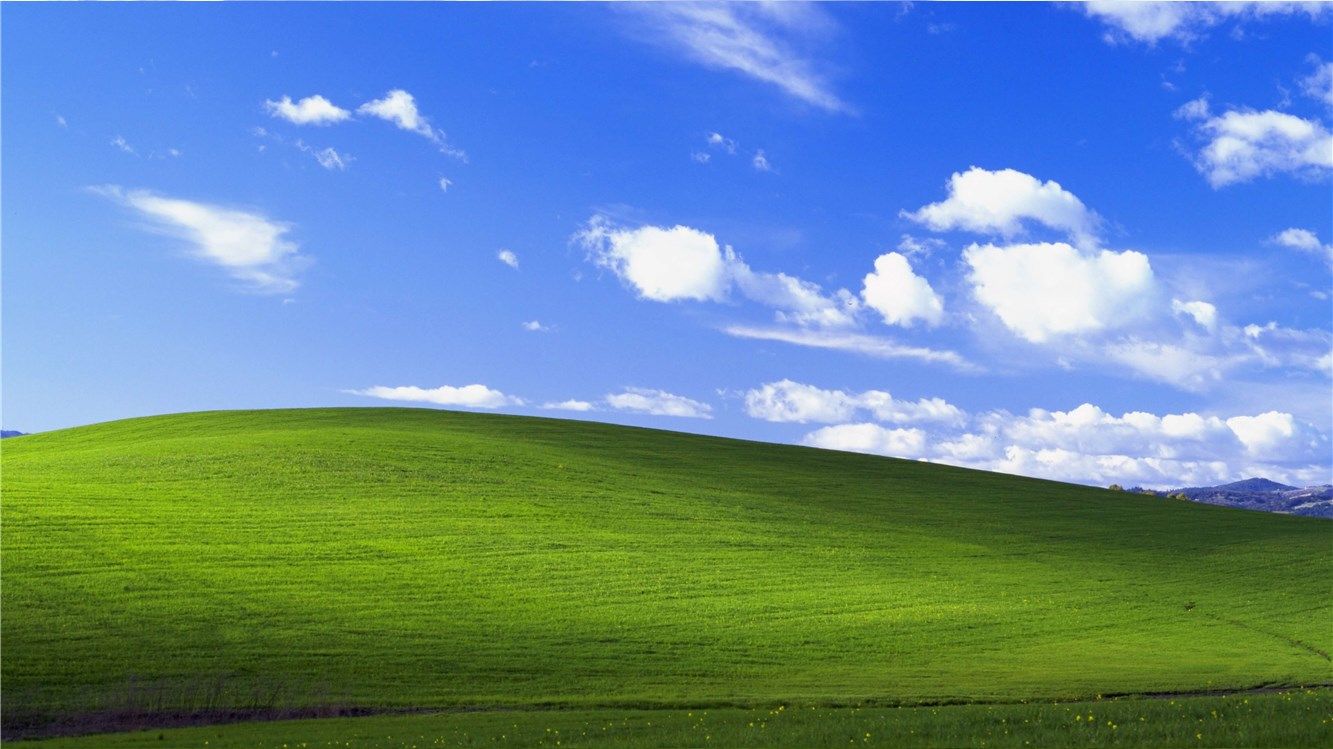 O plano de fundo da área de trabalho do Windows XP.