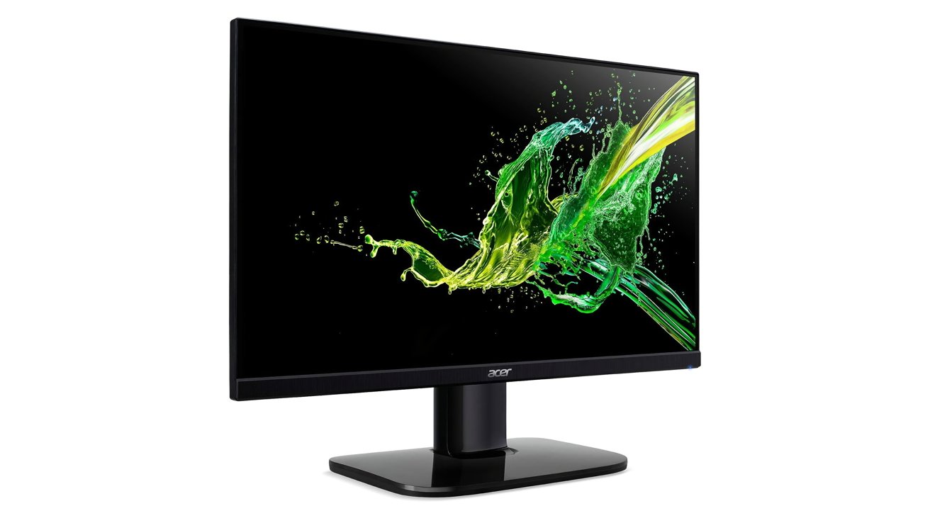 Monitor Acer exibindo vibrantes respingos abstratos verdes e amarelos em uma tela preta, montado em um elegante suporte preto.