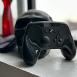 Steam Controller from Valve sitting on a counter next to a skull